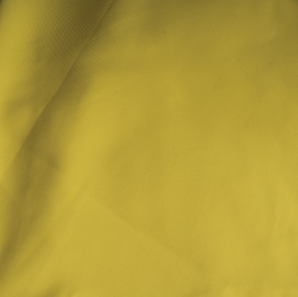 Close up of a yellow polyester tablecloth.